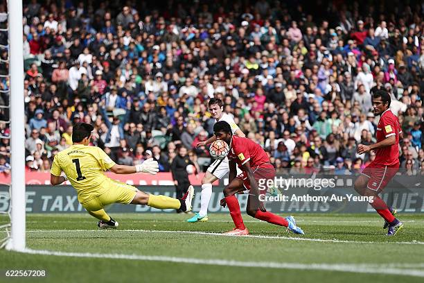 Marco Rojas of New Zealand shoots and scores the opening goal during the 2018 FIFA World Cup Qualifier match between the New Zealand All Whites and...