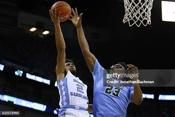 Joel Berry II of the North Carolina Tar Heels shoots against Blake Paul of the Tulane Green Wave during the second half of a game at the Smoothie...