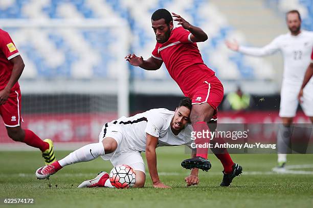 Bill Tuiloma of New Zealand competes against Joel Wakanumune of New Caledonia during the 2018 FIFA World Cup Qualifier match between the New Zealand...