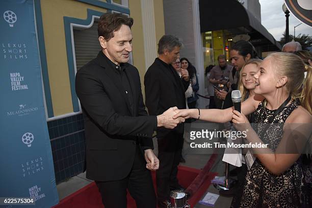 Matt Ross greets a young journalist at the screening of "Captain Fantastic" during the Napa Valley Film Festival at the Uptown Theater on November...