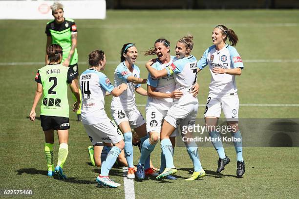 Laura Alleway of Melbourne United celebrates with her team after scoring a goal during the round two W-League match between Canberra United and...