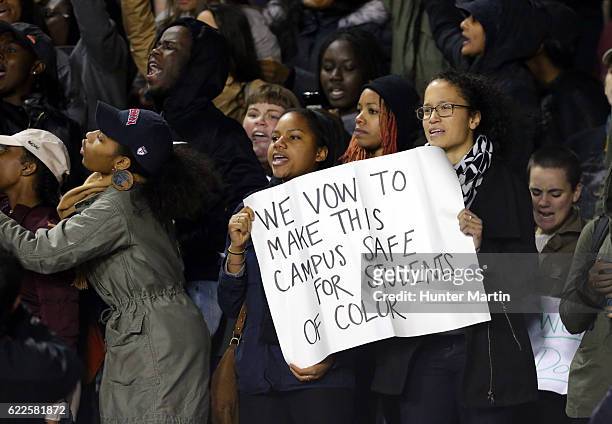 Students conduct a protest during a football game between the Harvard Crimson and the Penn Quakers on November 11, 2016 at Franklin Field on the...