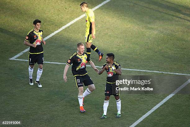 Fabio Ferreira and Connor Pain of the Phoenix runs to congratulate Roy Krishna of the Phoenix as he celebrates scoring a goal during the round six...