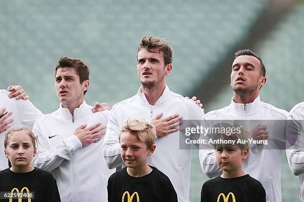 Marco Rojas, Deklan Wynne and Ryan Thomas of New Zealand sing the national anthem prior to the 2018 FIFA World Cup Qualifier match between the New...