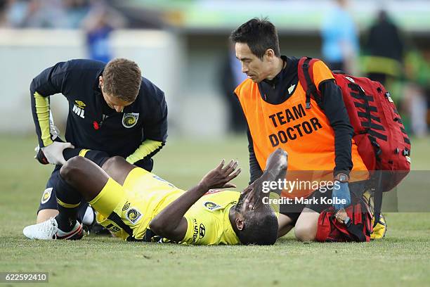 Jacques Faty of the Mariners receives attention from the trainer during the round six A-League match between the Central Coast Mariners and the...