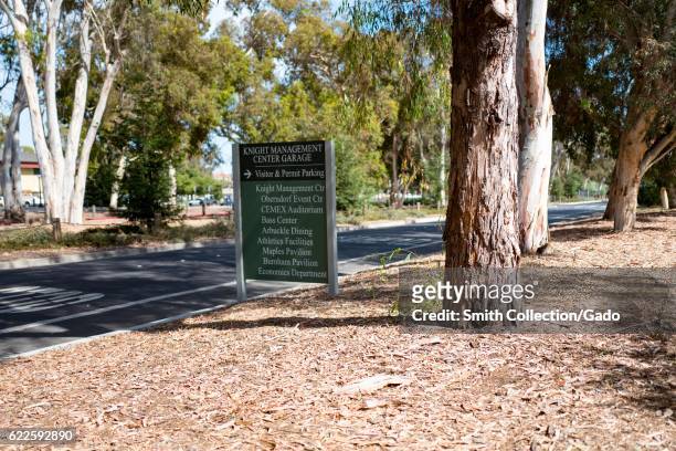 Sign next to a one-way street directs drivers to various buildings on campus, Stanford University, California, September 3, 2016. .