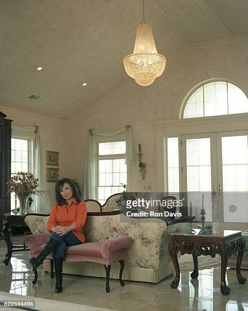 American country music singer-songwriter Lorreta Lynn poses for a portrait in her living room circa 1997 in Hurricane Mills, Tennessee.