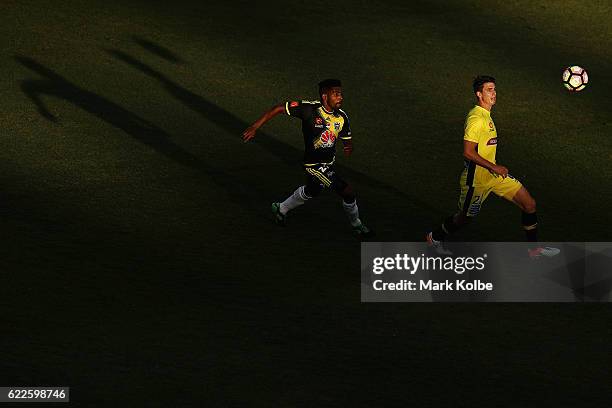 Roy Krishna of the Phoenix and Michael Neill of the Mariners compete for the ball during the round six A-League match between the Central Coast...