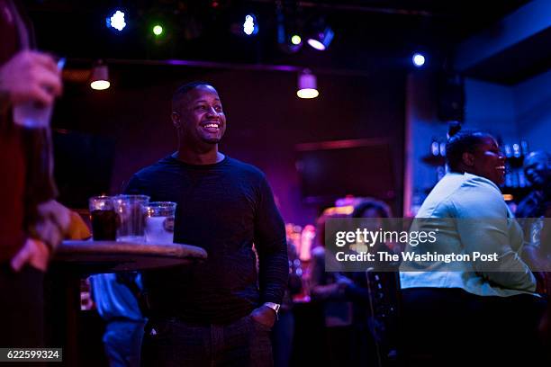 Comedian and former Baltimore cop Timmy Hall waits to go on stage as other comedians perform during Thursday's open mic standup night at RFD in...