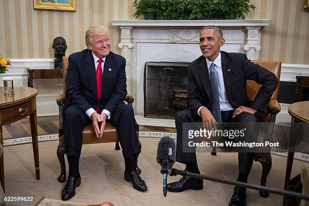 President Barack Obama and President-elect Donald Trump talk to members of the media during a meeting in the Oval Office of the White House in...