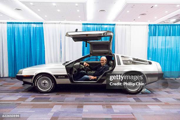 Actor Christopher Lloyd sits in a DeLorean DMC-12 for "Back the Future Day" at Fan Expo Vancouver 2016 at the Vancouver Convention Centre on November...