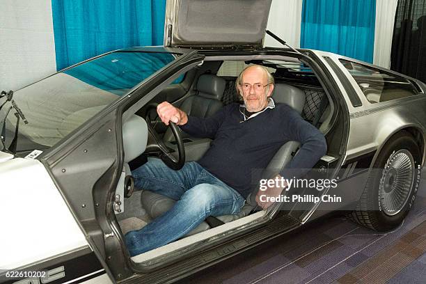 Actor Christopher Lloyd sits in a DeLorean DMC-12 for "Back the Future Day" at Fan Expo Vancouver 2016 at the Vancouver Convention Centre on November...