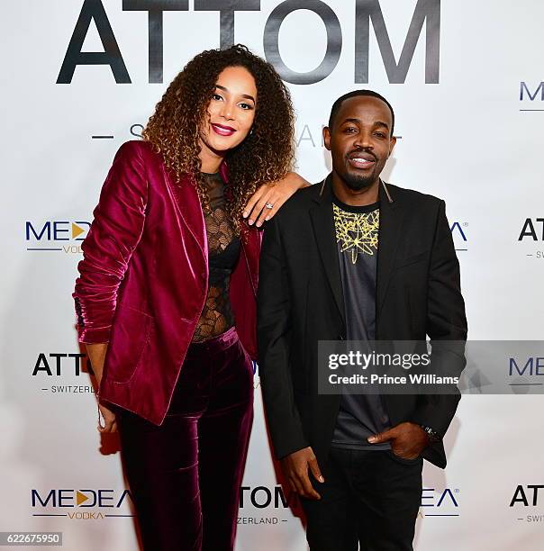 Bertille Sefolosha and Zola Dias attend the ATTOM atlanta Store Private Opening on November 11, 2016 in Atlanta, Georgia.