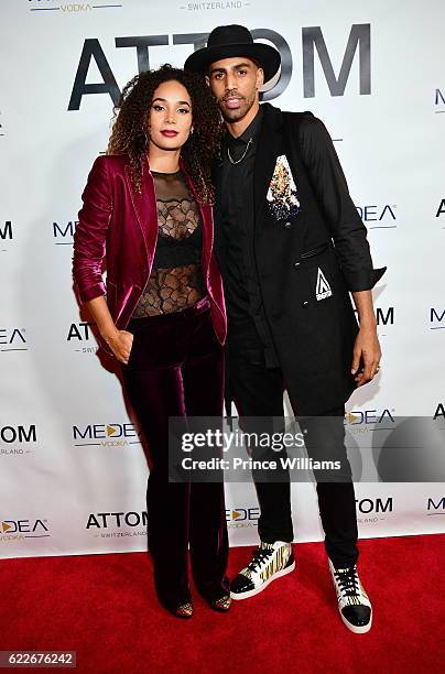 Bertille Sefolosha and Thabo Sefolosha attend the ATTOM Atlanta Store Private Opening on November 11, 2016 in Atlanta, Georgia.