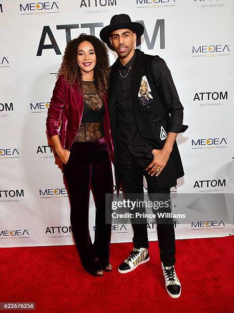 Bertille Sefolosha and Thabo Sefolosha attend the ATTOM Atlanta Store Private Opening on November 11, 2016 in Atlanta, Georgia.