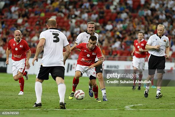 Lee Hendrie of England lines up a shot during the Battle of Europe match between England Masters and Germany Masters at Singapore Stadium on November...