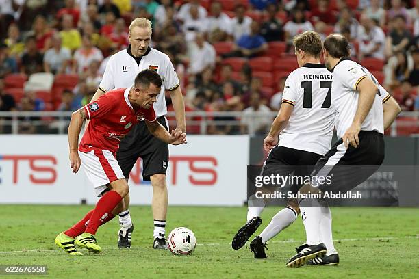 Lee Hendrie of England tries to get past the Germany defence during the Battle of Europe match between England Masters and Germany Masters at...