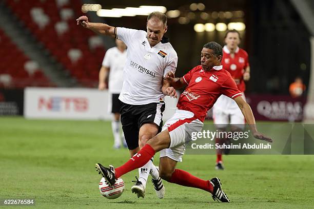Alexander Zickler of Germany and Des Walker of England challenge for the ball during the Battle of Europe match between England Masters and Germany...