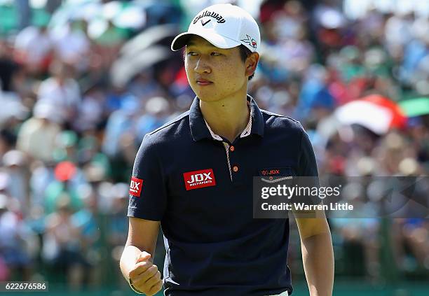 Jeunghun Wang of Korea celebrates a birdie on the 18th green during the third round of the Nedbank Golf Challenge at the Gary Player CC on November...