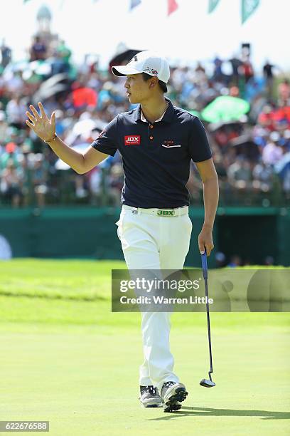 Jeunghun Wang of Korea celebrates a birdie on the 18th green during the third round of the Nedbank Golf Challenge at the Gary Player CC on November...