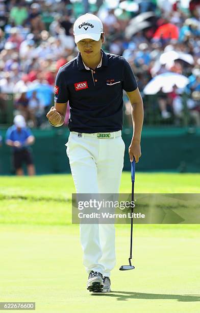 Jeunghun Wang of Korea celebrates a birdie on the 18th green during the third round of the Nedbank Golf Challenge at the Gary Player CC on November...