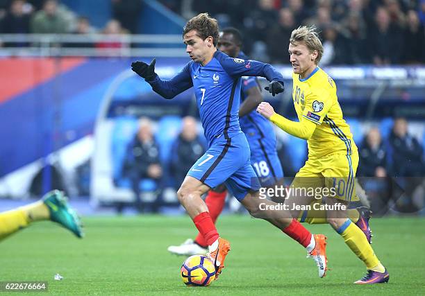 Antoine Griezmann of France and Emil Forsberg of Sweden in action during the FIFA 2018 World Cup Qualifier between France and Sweden at Stade de...