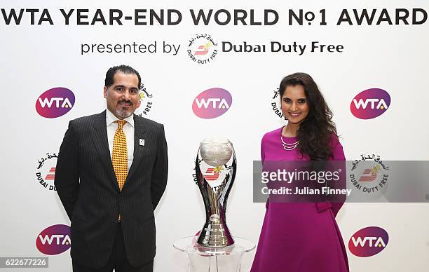 Year-End World No.1 Doubles player Sania Mirza of India poses with Salah Tahlak from Dubai Duty Free during day 3 of the BNP Paribas WTA Finals...