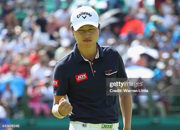 Jeunghun Wang of Korea celebrates a birdie on the 18th green during the third round of the Nedbank Golf Challenge at the Gary Player CC on November...