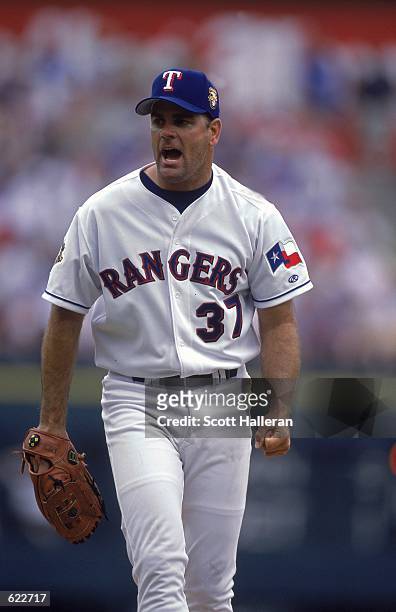 Kenny Rogers of the Texas Rangers cheers during the game against the Anaheim Angels at The Ballpark in Arlington, Texas. The Rangers defeated the...