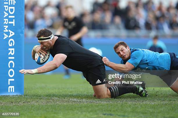 Wyatt Crockett of the New Zealand All Blacks scores a try during the international rugby match between New Zealand and Italy at Stadio Olimpico on...