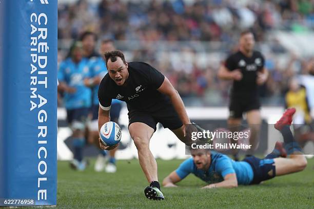 Israel Dagg of the New Zealand All Blacks scores a try during the international rugby match between New Zealand and Italy at Stadio Olimpico on...