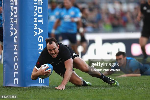 Israel Dagg of the New Zealand All Blacks scores a try during the international rugby match between New Zealand and Italy at Stadio Olimpico on...