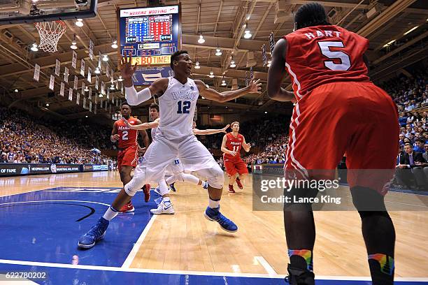 Javin DeLaurier of the Duke Blue Devils defends against Khallid Hart of the Marist Red Foxes during their game at Cameron Indoor Stadium on November...