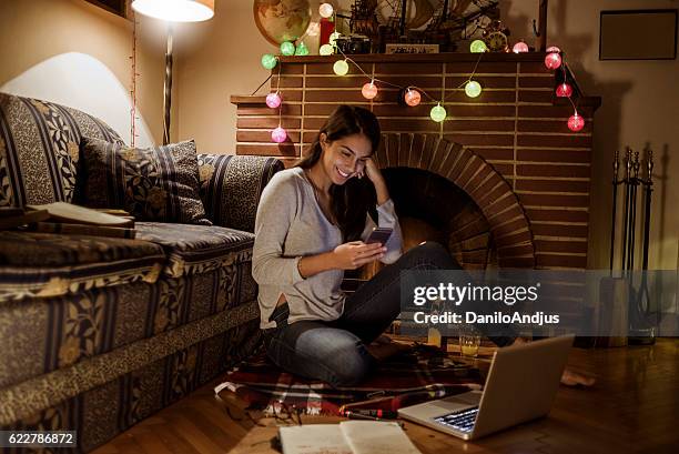 young woman using her smartphone and studying - hot latin nights stock pictures, royalty-free photos & images