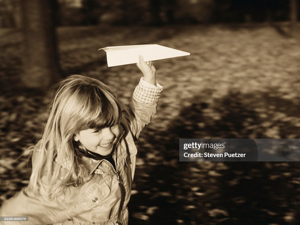 Girl with Paper Airplane