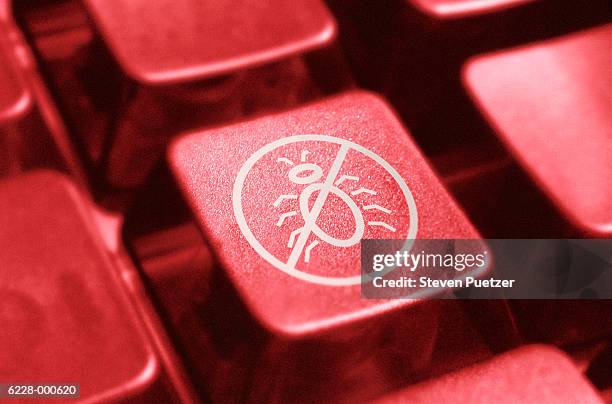 computer key with icon showing red line through ?bug' - computer failure stock pictures, royalty-free photos & images