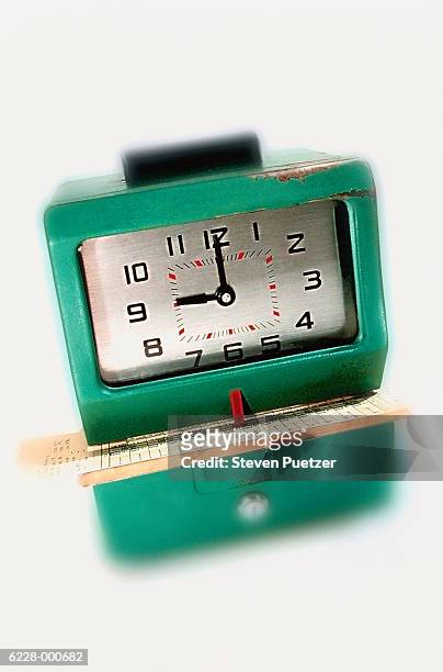 time card in time clock - stechkarte stock-fotos und bilder