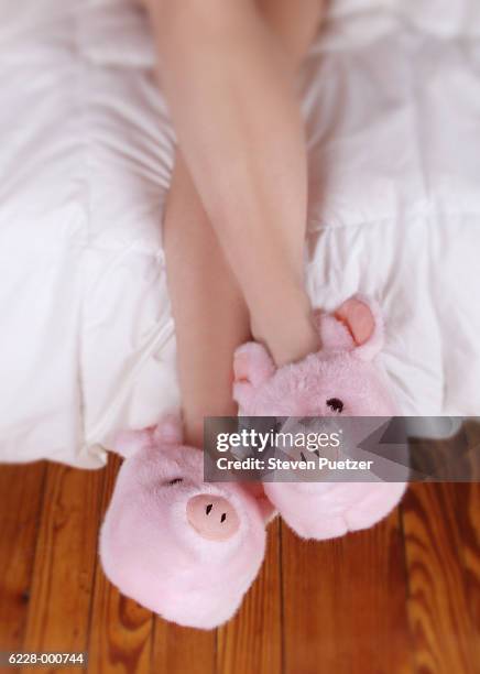 woman in pig slippers - pantoffel stockfoto's en -beelden