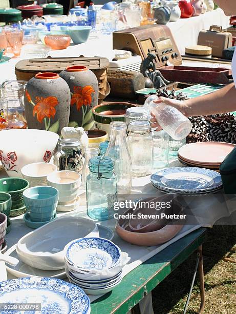 objects for sale at flea market - rommelmarkt stockfoto's en -beelden