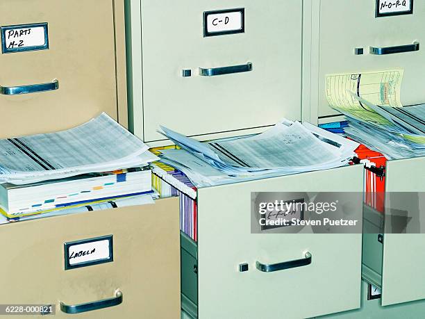 paperwork and file cabinets - filing stock-fotos und bilder