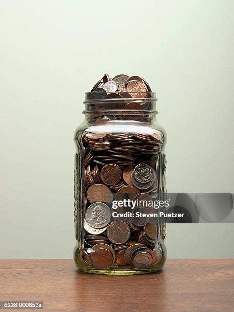 jar of coins - jarred stock pictures, royalty-free photos & images