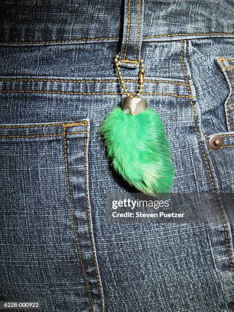 rabbit's foot on jeans - luck charm stock pictures, royalty-free photos & images