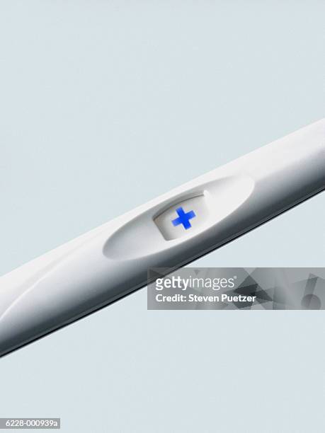 positive pregnancy test - pregnancy test stock pictures, royalty-free photos & images