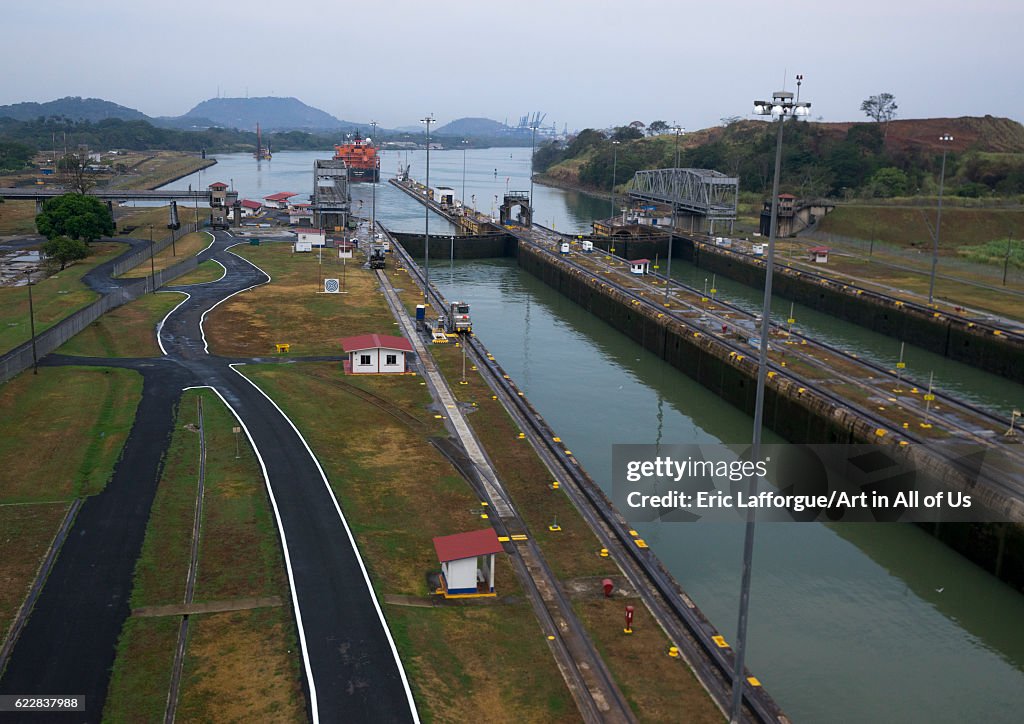 Panama, Province of Panama, Panama city, Container ship passing through the miraflores locks in the Panama canal...
