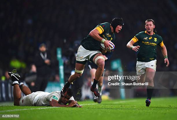 Warren Whiteley of South Africa takes on Billy Vunipoa of England during the Old Mutual Wealth Series match between England and South Africa at...