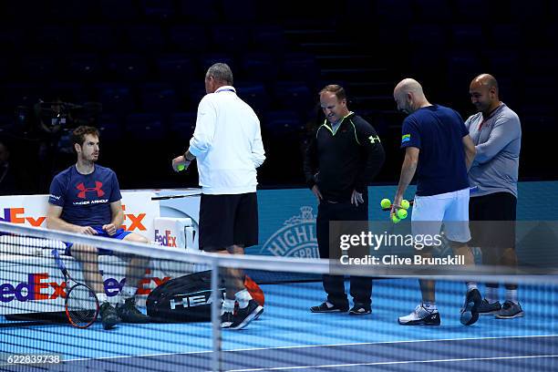 Andy Murray of Great Britain speaks with his coach Ivan Lendl, Jamie Delgado, Matt Little and Shane Annun during a practice session during previews...