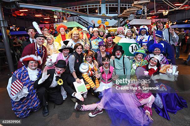 Group Vice President, Macy's Parade and Entertainment Group Amy Kule poses with a group of professional clowns as Macy's prepares for the 90th Macy's...