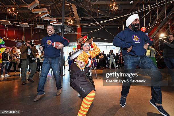 Professional clowns perform with volunteers as Macy's prepares for the 90th Macy's Thanksgiving Day Parade at Clown U. At Bowlmor Chelsea Piers on...