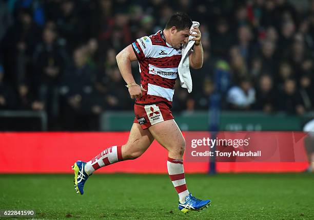 Henry Walker of Gloucester Rugby runs off the pitch for a blood replacement during the Anglo-Welsh Cup match between Northampton Saints and...