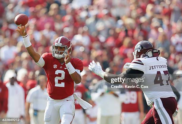 Jalen Hurts of the Alabama Crimson Tide passes against A.J. Jefferson of the Mississippi State Bulldogs at Bryant-Denny Stadium on November 12, 2016...